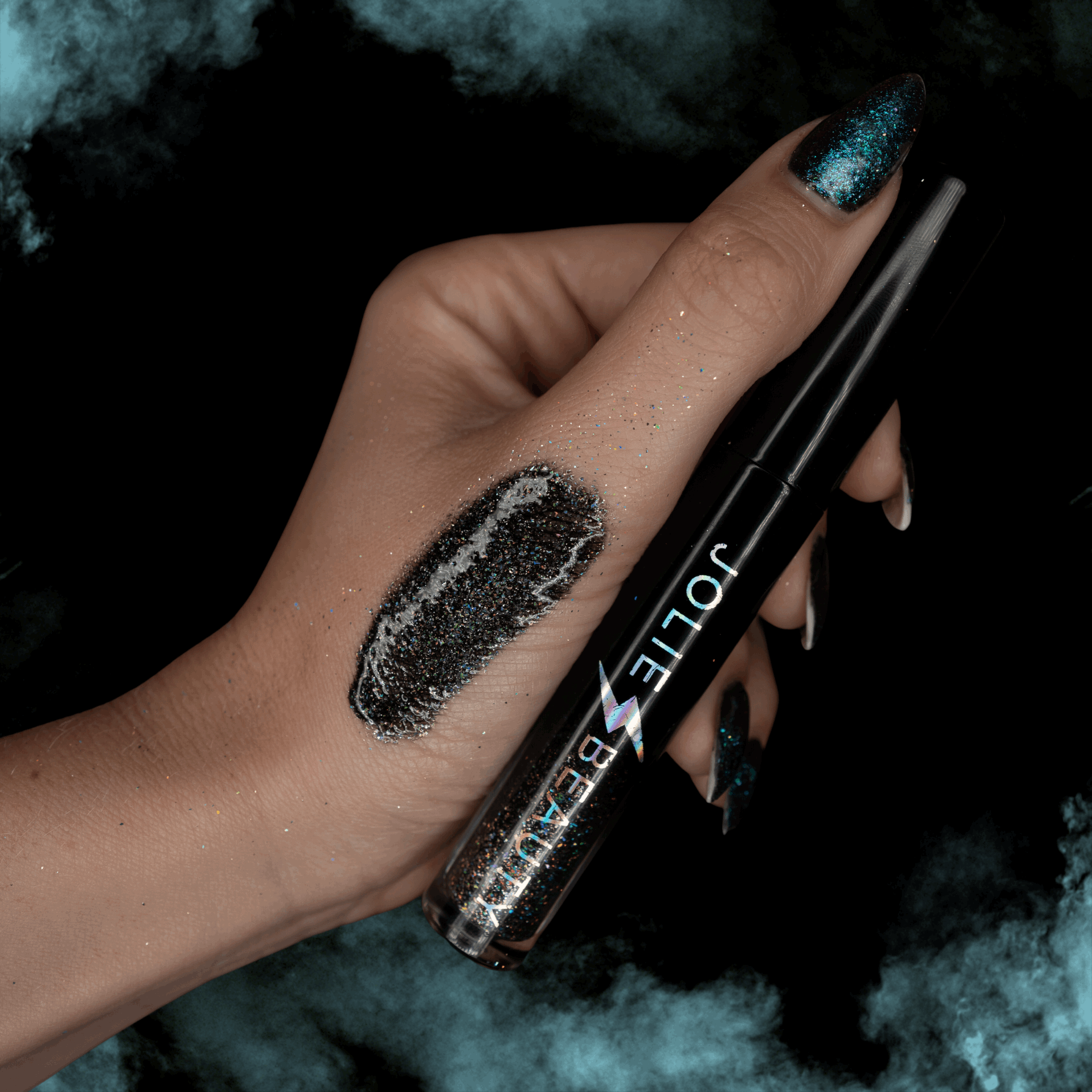 Black holographic glitter lip gloss on lips with multidimensional sparkle, Jolie Beauty So Below shade