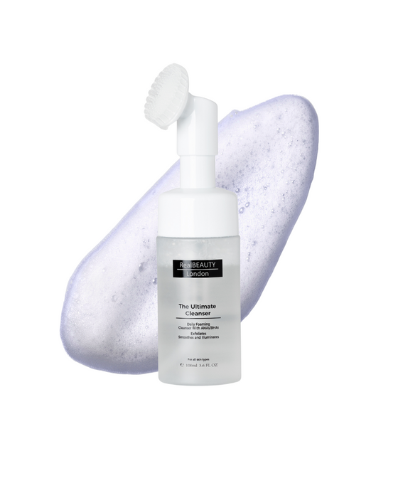 Skincare bottle labeled 'The Ultimate Cleanser' with a foam applicator on a white background