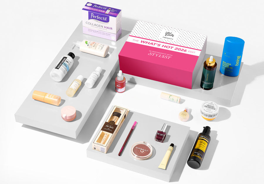 Assorted beauty products on a white surface with a pink box labelled 'What's Hot 2023'.
