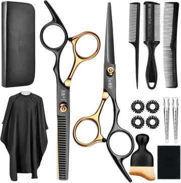 Set of barber tools including scissors, combs, and a cape on a white background