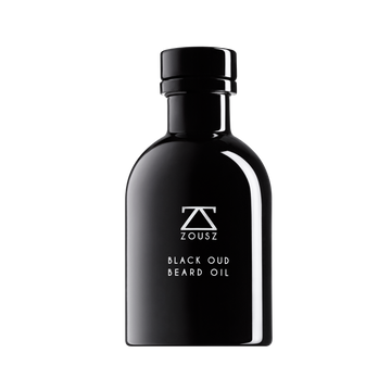 Black bottle of Zousz Black Oud Beard Oil on a white background