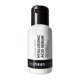 Hyaluronic acid serum bottle with black cap on a white background