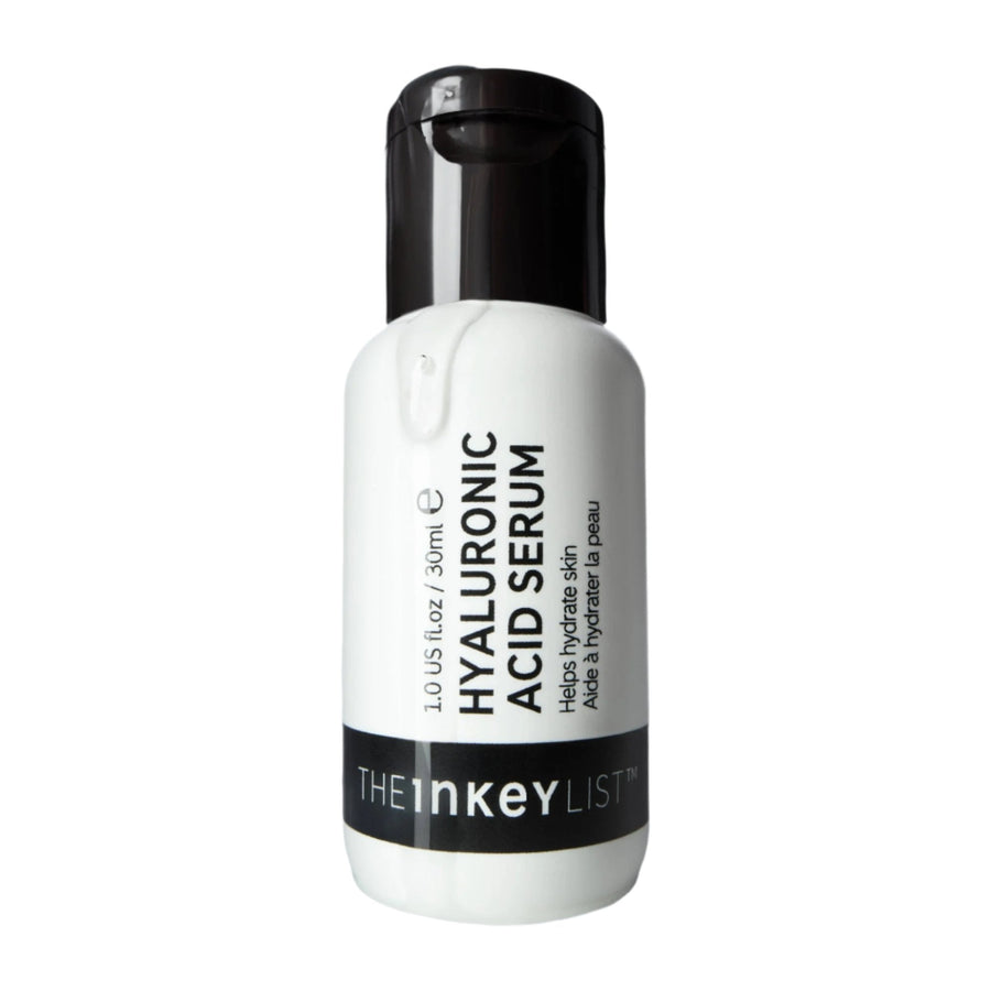 Hyaluronic acid serum bottle with black cap on a white background