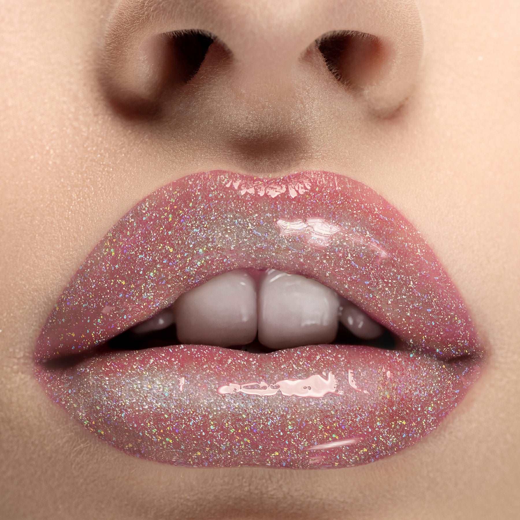 Close-up of a person's lips with glittery pink lipstick