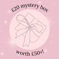 Mystery box promotion with a pink background and a bow illustration.