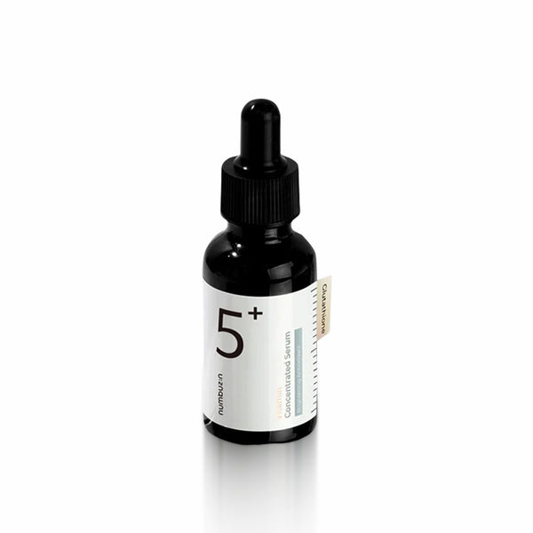 Black dropper bottle with white label on a white background