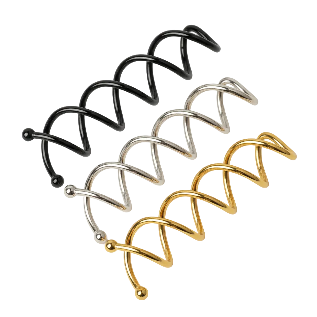 Set of black, silver, and gold nose rings on a white background