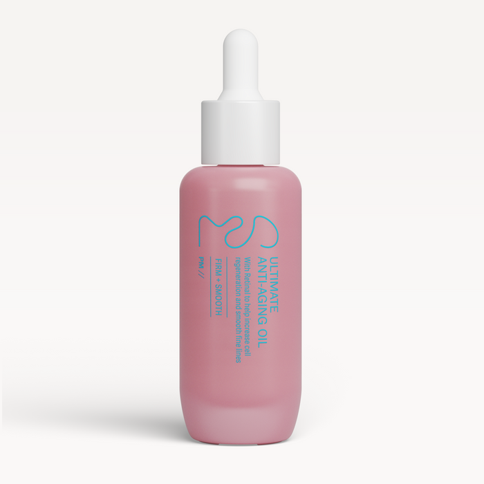 Pink skincare serum bottle with dropper on a white background
