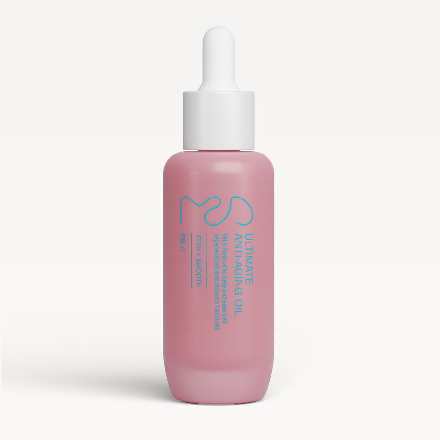 Pink skincare serum bottle with dropper on a white background