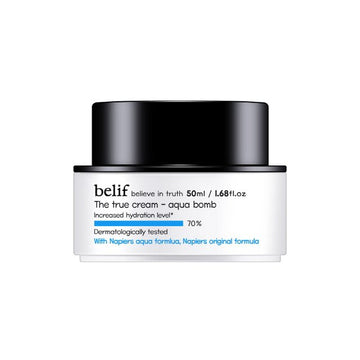 Skincare product jar with black lid and white body on a white background