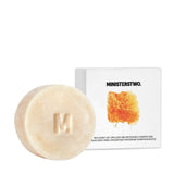 Bar of soap with a packaging box labeled 'MINISTER TWO' on a white background