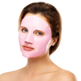 Model applying a Raw Beauty Lab vegan collagen sheet mask