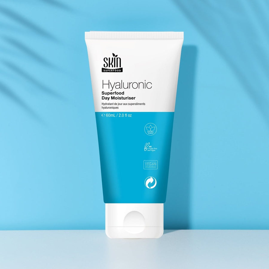 SF Hyaluronic Superfood Day Moisturiser 60ml tube on blue background, showcasing its hydrating formula.