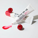 SOME BY MI lip balm and lip sun protector with raspberries on a light background