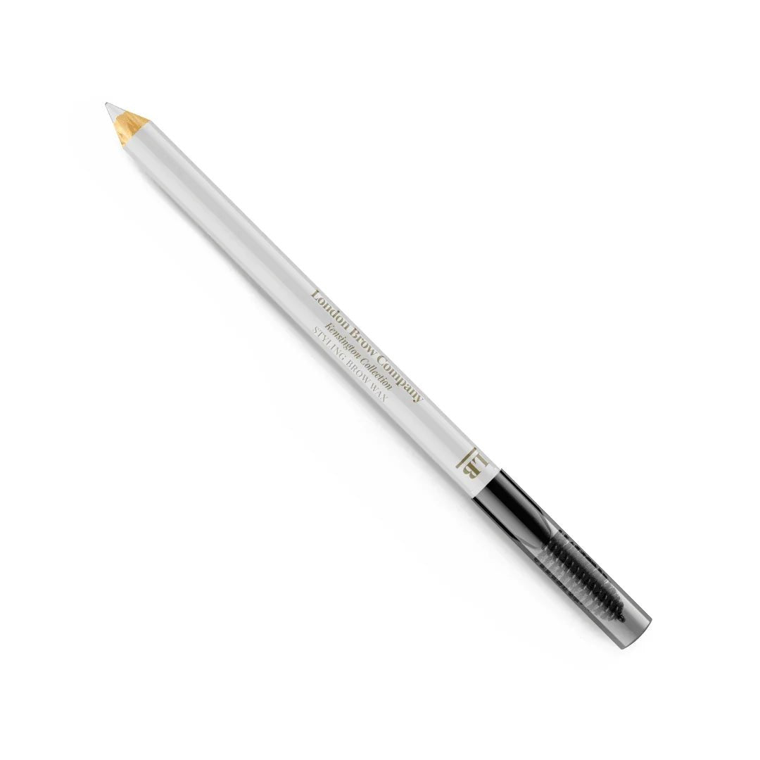 White eyeliner pencil with gold tip on a white background